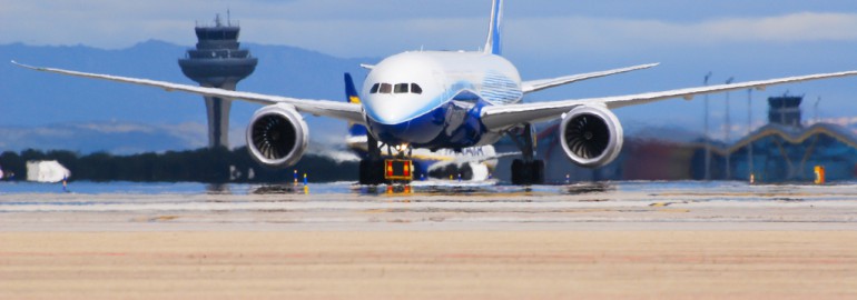 Brand new boeing 787 at Madrid airport with T4 in the background. By José A. - Flickr.