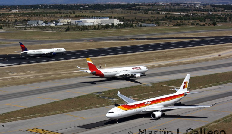 Two Iberias and one Delta operating on the Madrid airport runways